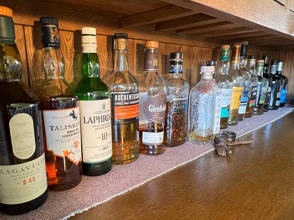 FOOD 15 A shelf of many different Scottish single malt whiskys